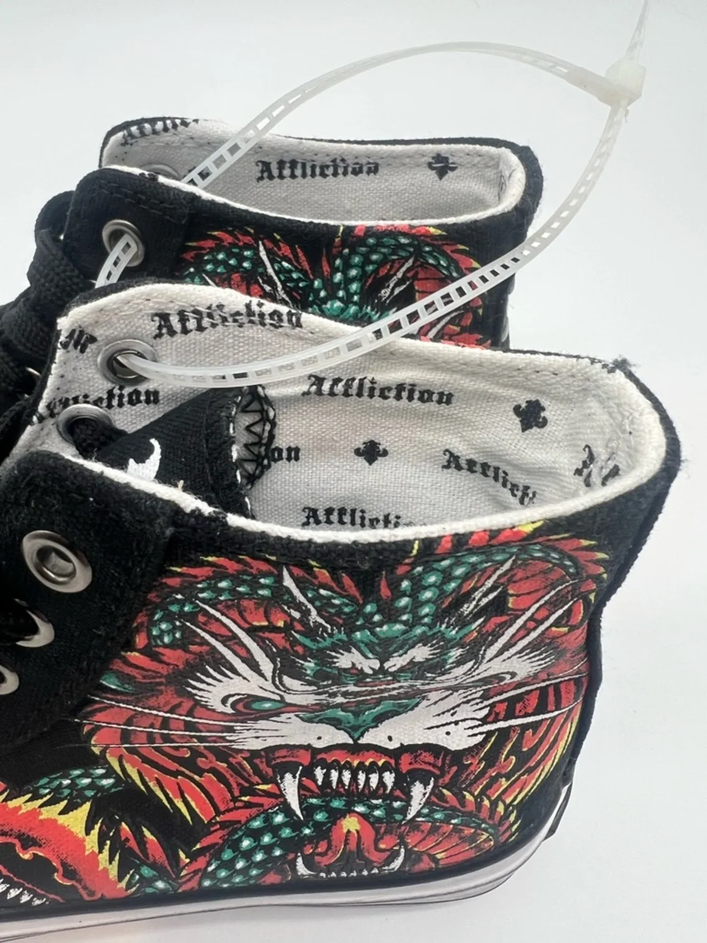 Affliction feature eyelets